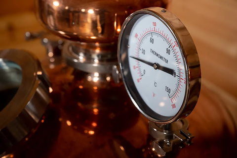 close up of gin still thermometer
