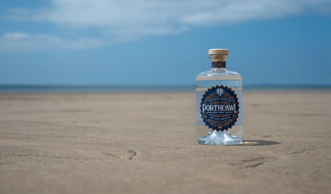 porthcawl london dry gin bottle on beach